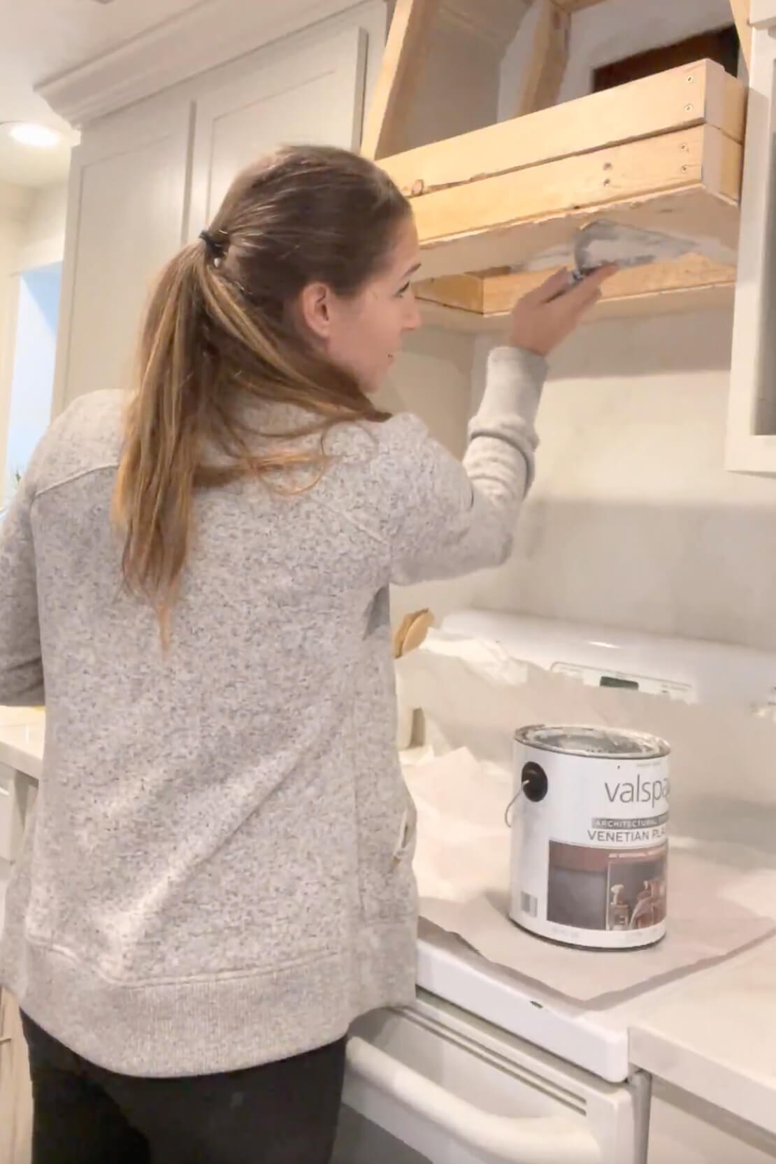 Applying venetian plaster to my DIY range hood.